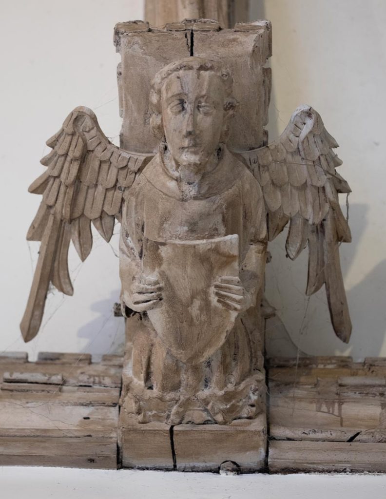 Angel holding shield