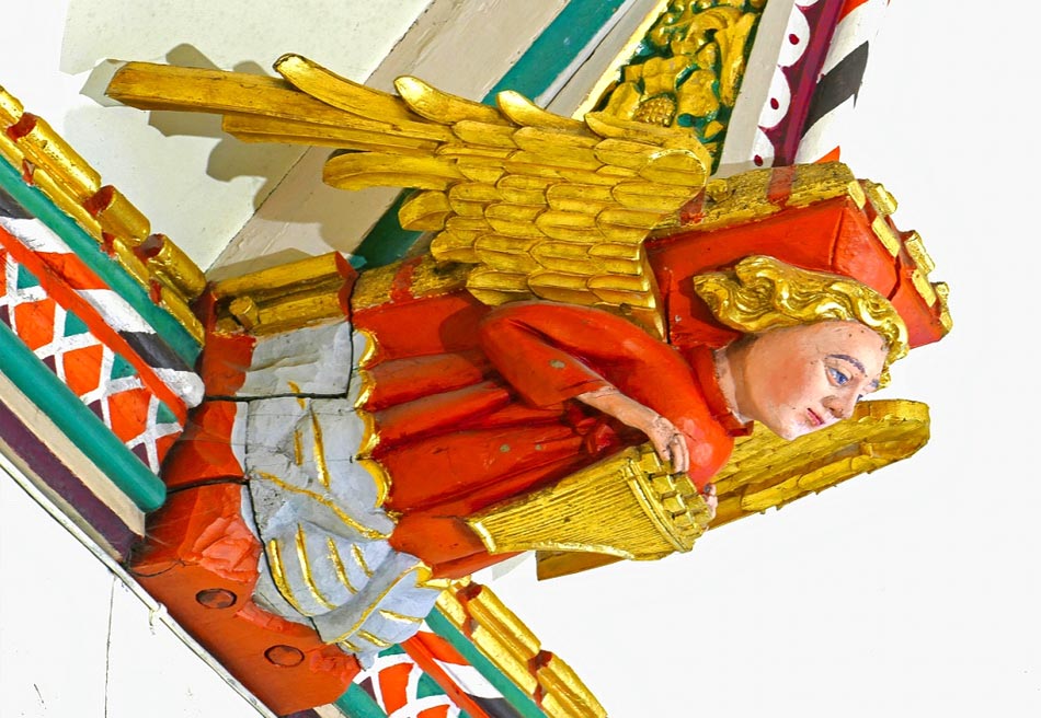 Angel playing harpsichord (side)