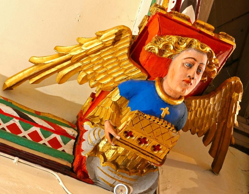 Next to Rood Screen: Angel holding reliquary