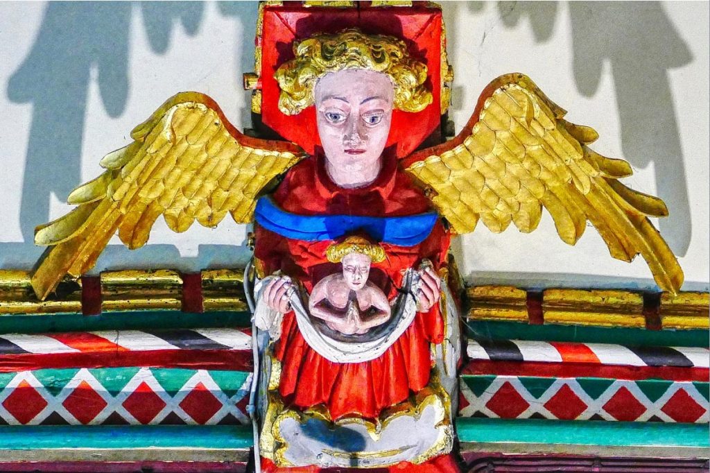 Guardian angel carrying a soul to heaven