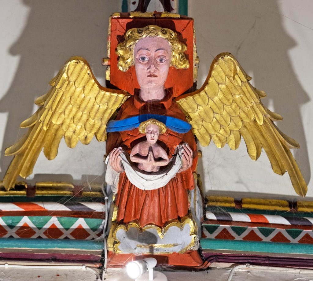 Guardian angel carrying a soul to heaven