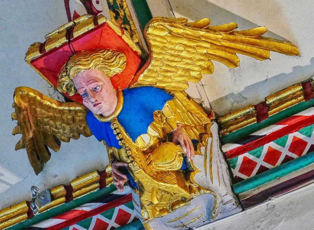 Angel playing portable organ