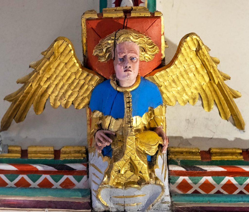 Angel playing portable organ