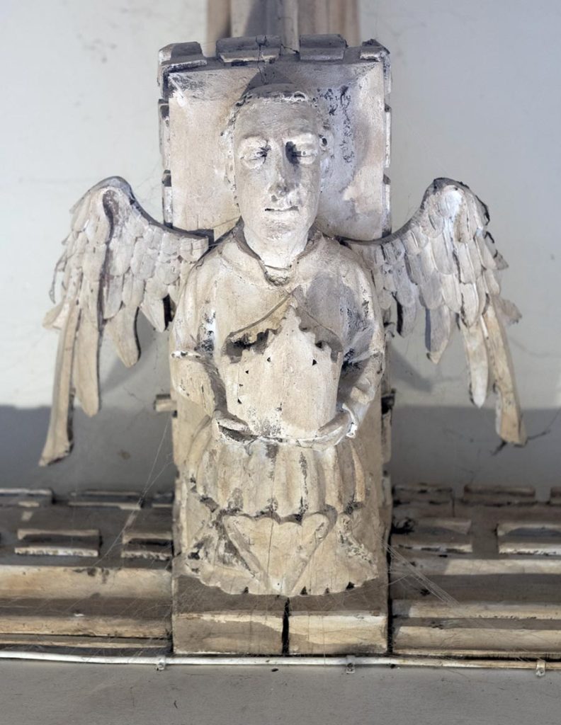 Angel holding mitre