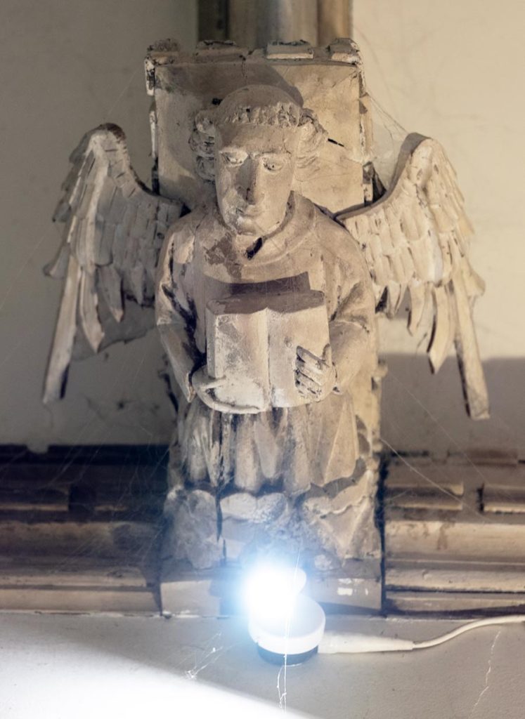 Angel MC holding open missal