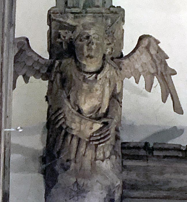Angel singing from open music book