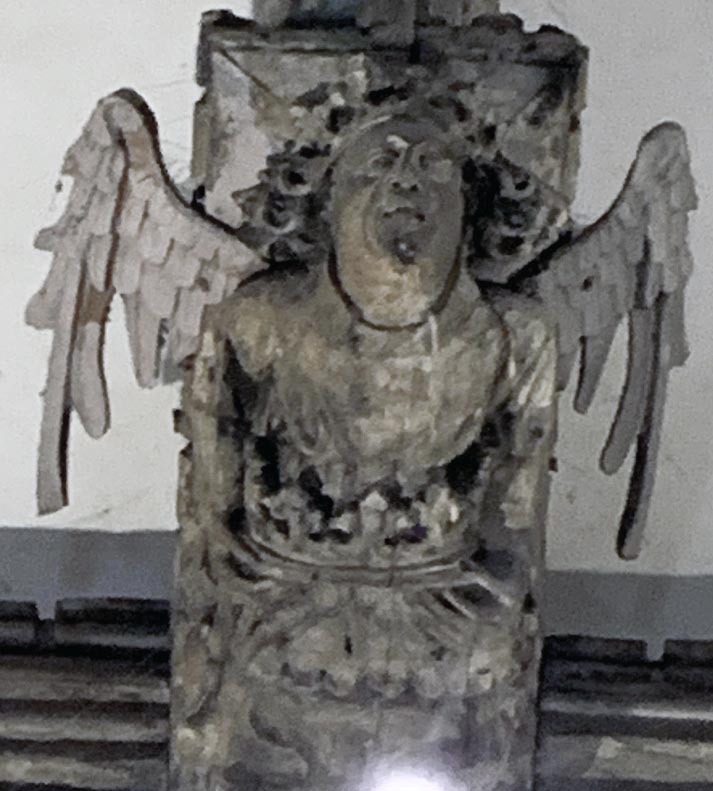 Angel holding crown