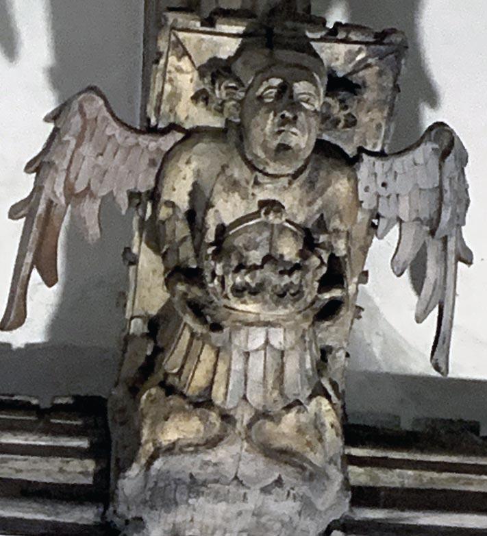 Angel holding another crown
