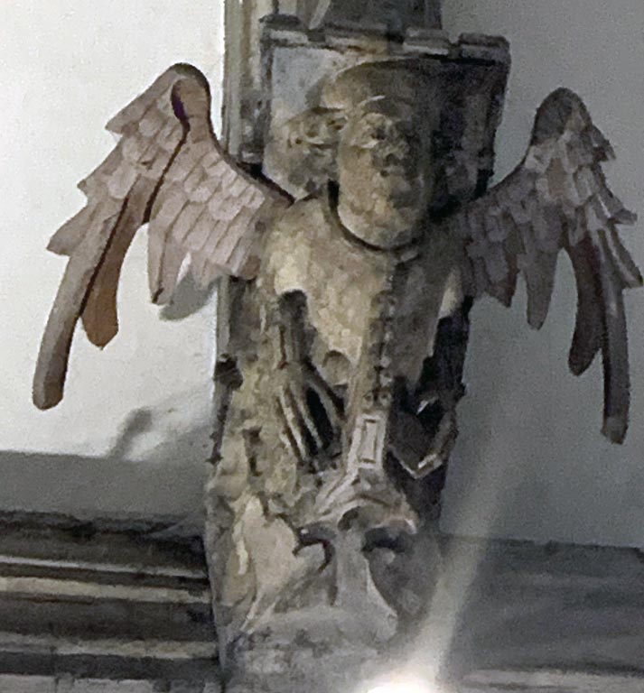 Angel playing a portable organ